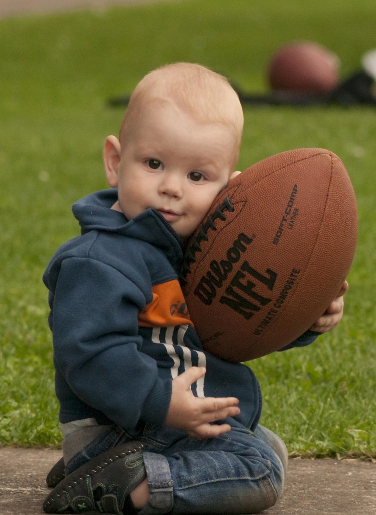 baby in possession of football